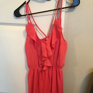 A coral spaghetti strap dress.
